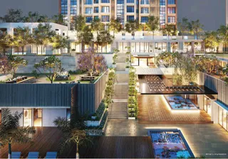 Modern luxury apartment complex with landscaped terraces, swimming pools, and rooftop amenities surrounded by trees.
