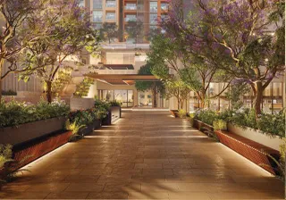 Modern luxury apartment complex with landscaped terraces, swimming pools, and rooftop amenities surrounded by trees.